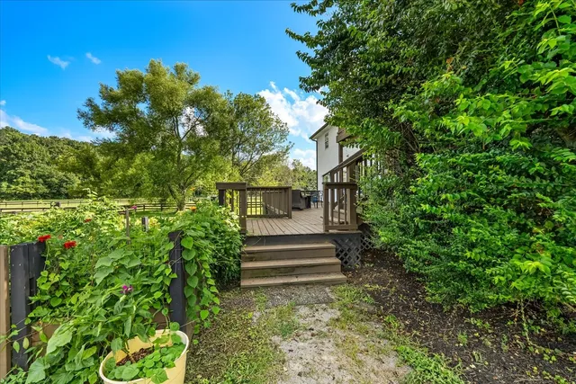 a view of house with backyard