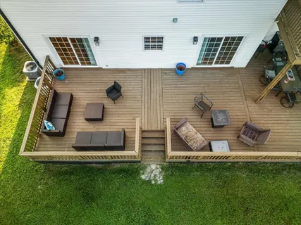 a view of a house with backyard and a patio