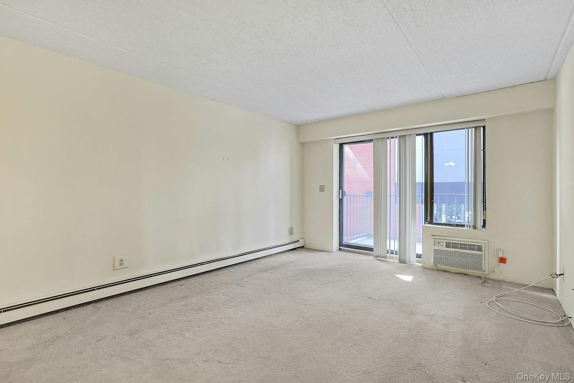 560 Halstead Avenue, Unit 2E Harrison, NY 10528 - Photo 11 of 28 an empty room with windows
