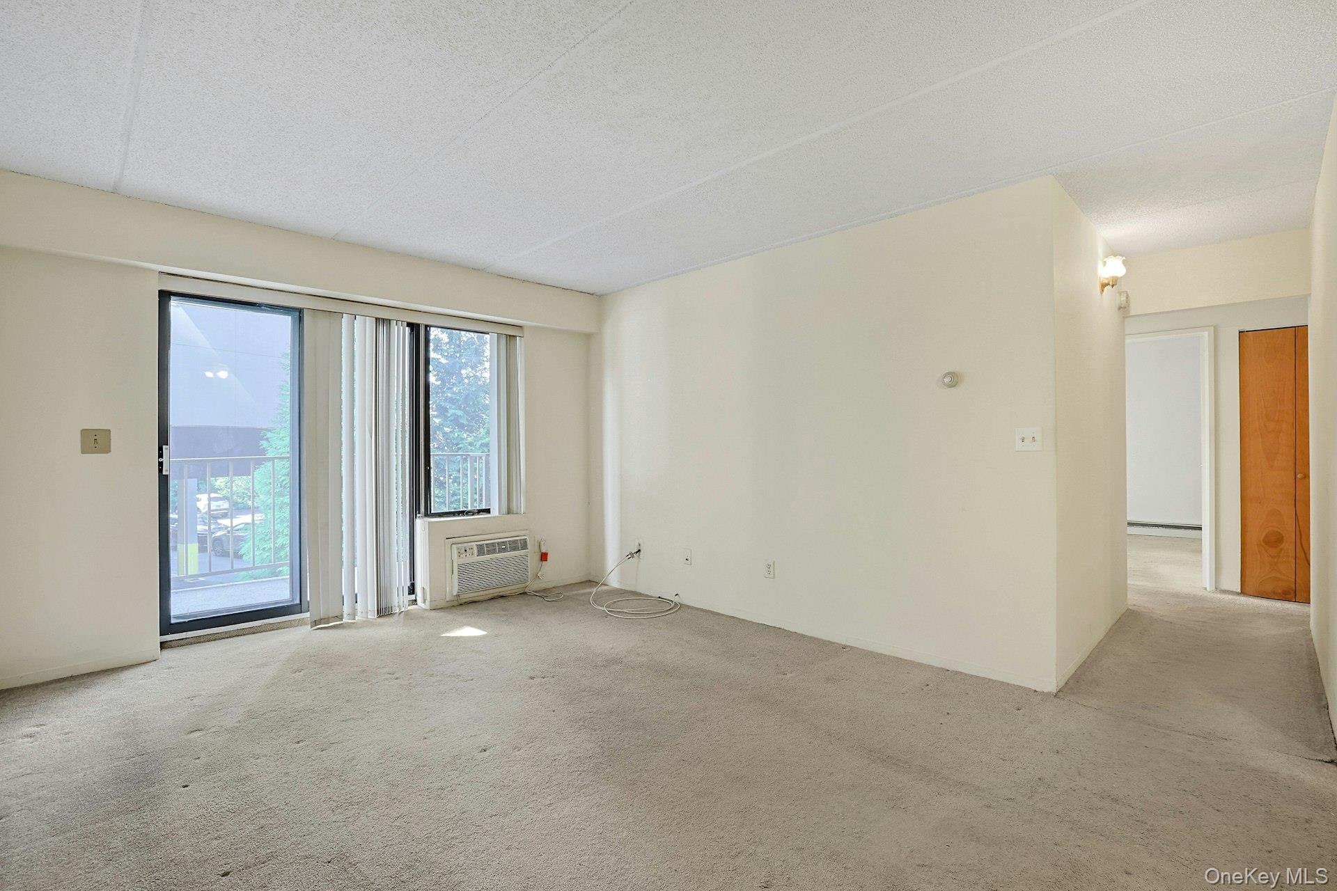 560 Halstead Avenue, Unit 2E Harrison, NY 10528 - Photo 12 of 28 a view of an empty room with glass door