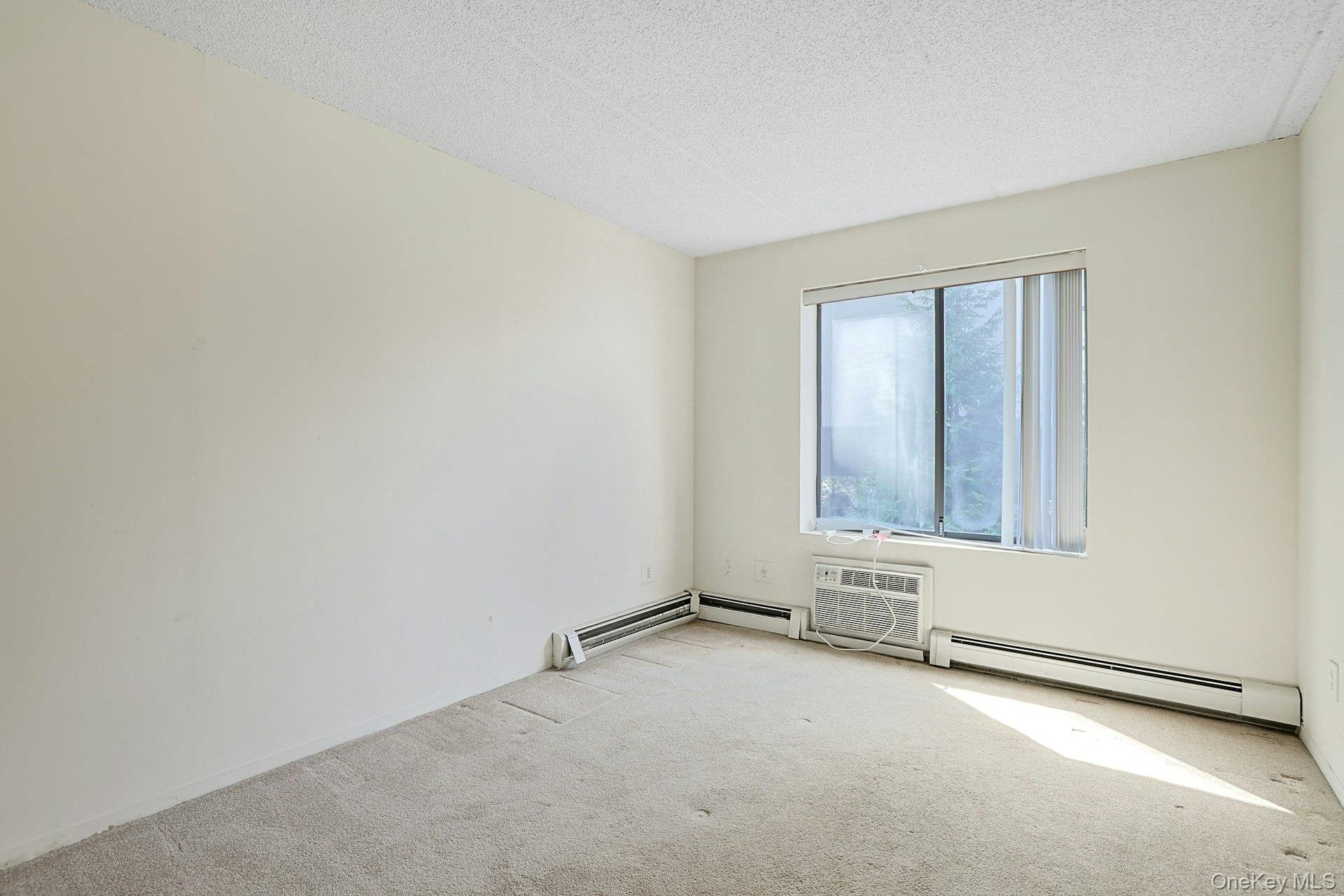 560 Halstead Avenue, Unit 2E Harrison, NY 10528 - Photo 15 of 28 an empty room with windows