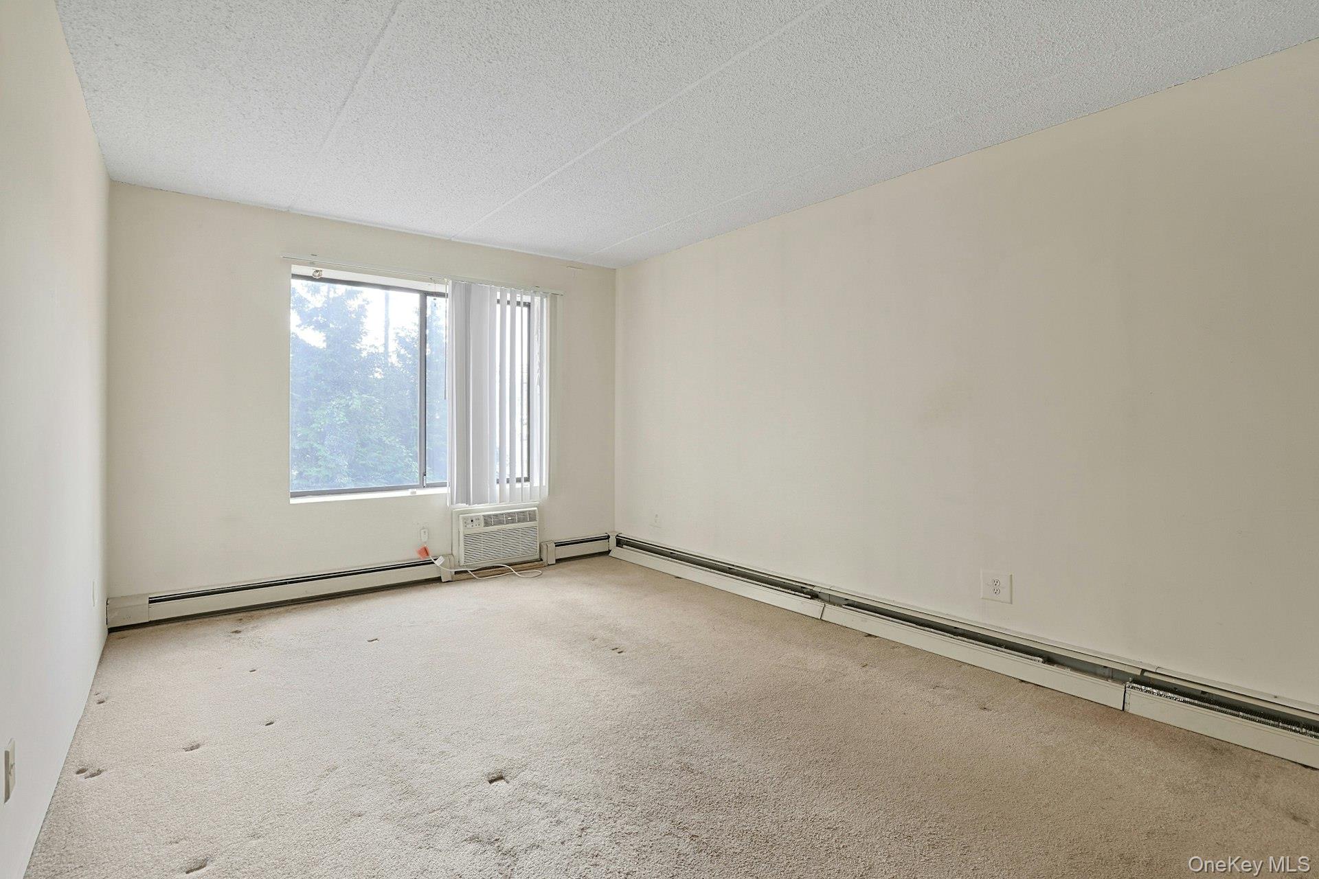 560 Halstead Avenue, Unit 2E Harrison, NY 10528 - Photo 17 of 28 an empty room with window