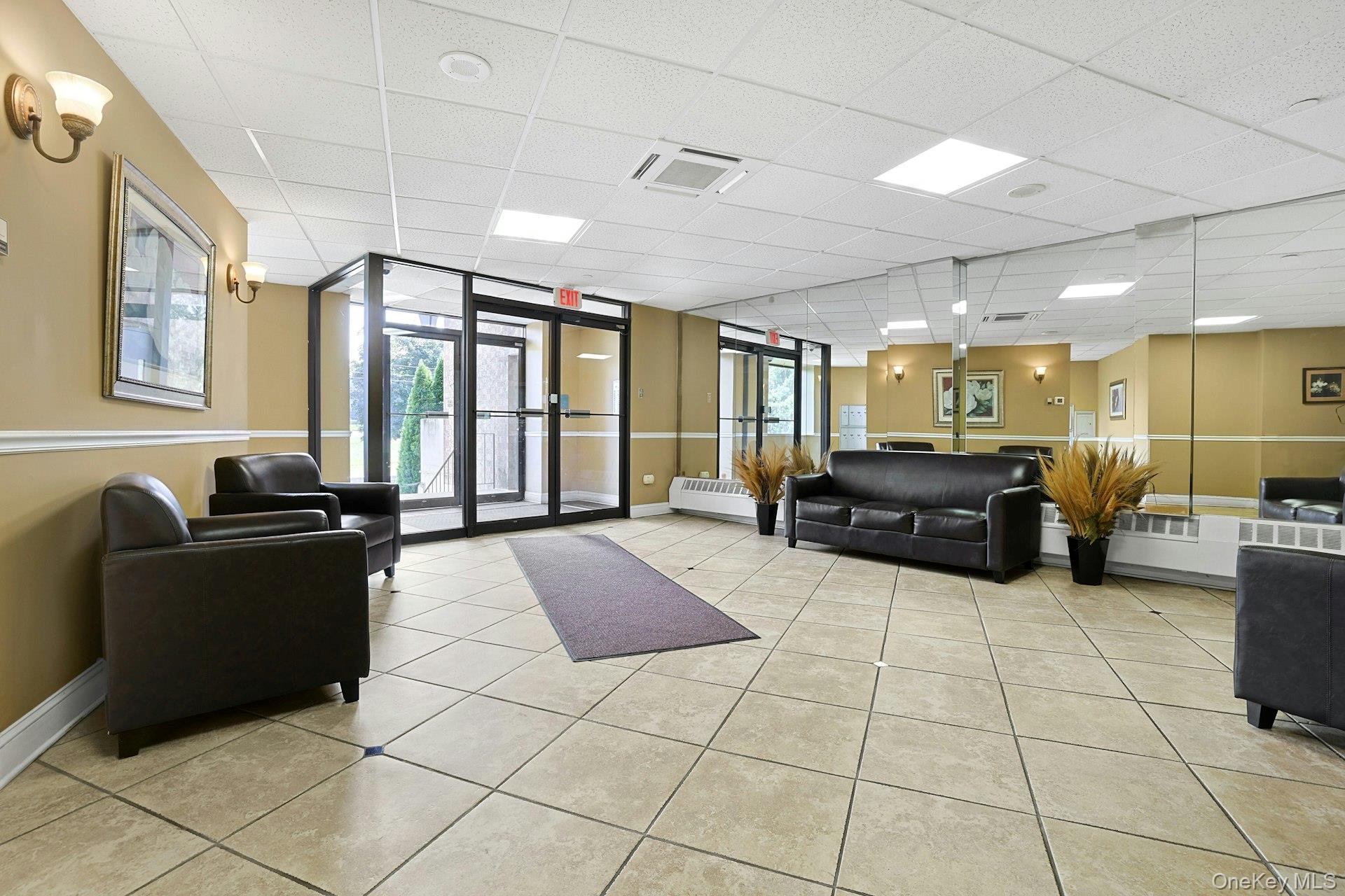 560 Halstead Avenue, Unit 2E Harrison, NY 10528 - Photo 22 of 28 a living room with furniture and a flat screen tv