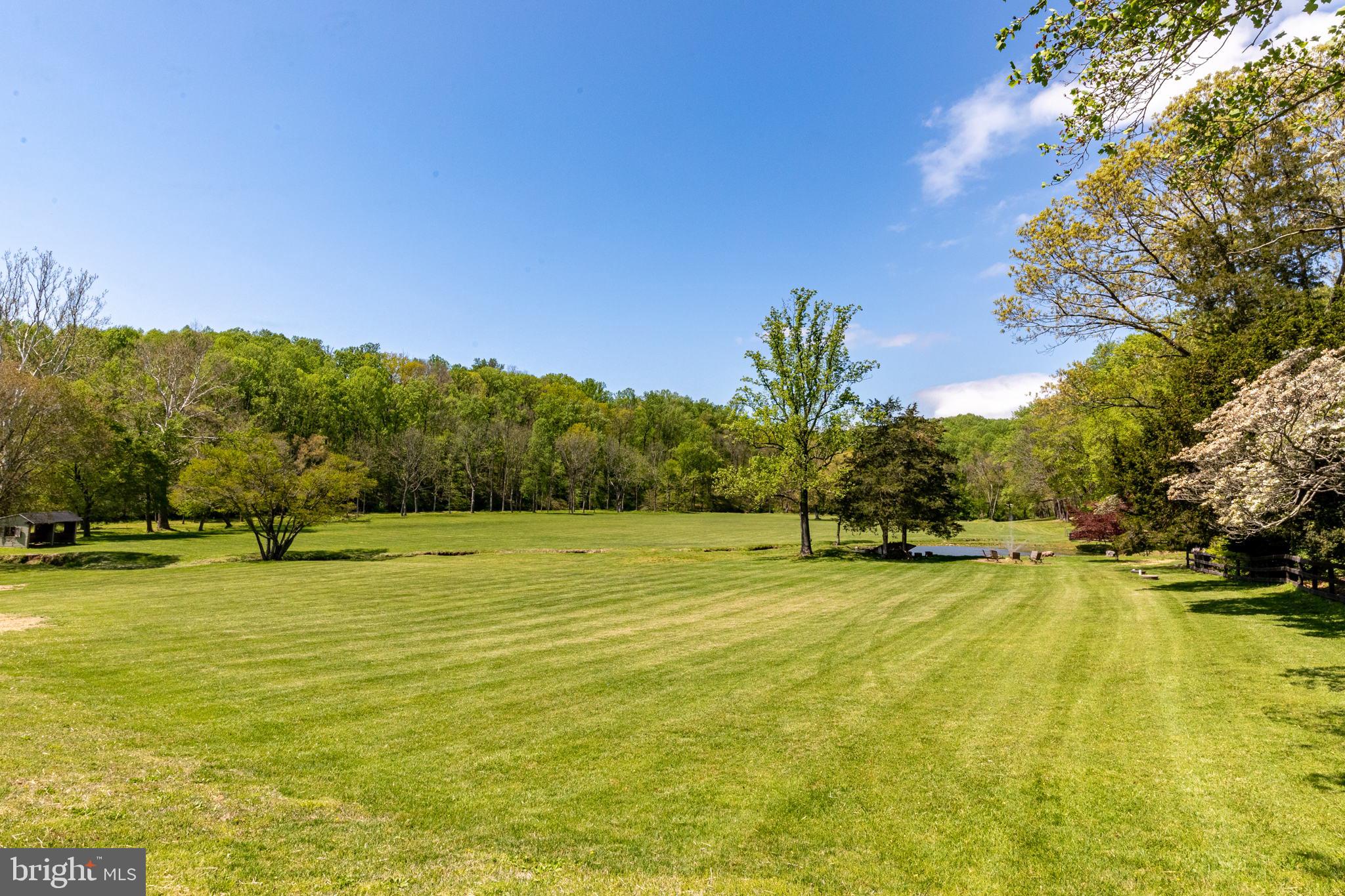 2310 Putnam Road Forest Hill, MD 21050 - Photo 16 of 90 Lush green landscape under a clear sky.