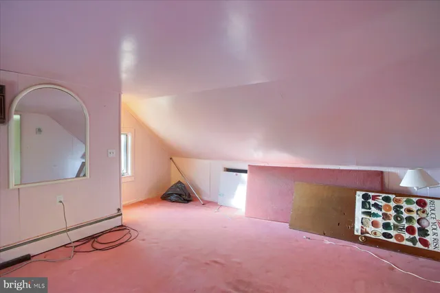 a view of empty room with workspace and window