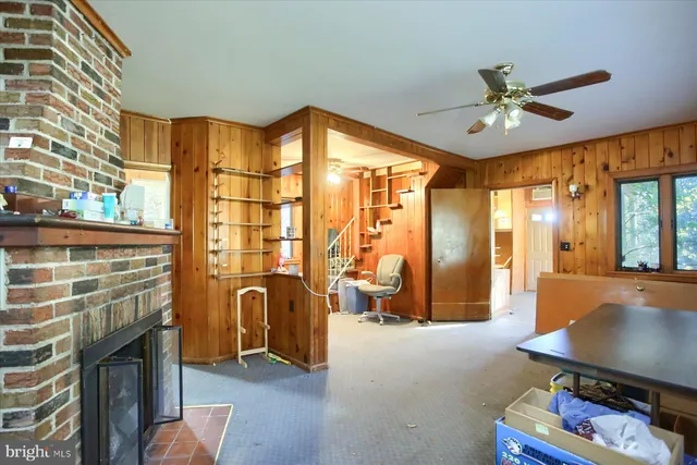 a view of a livingroom with furniture and a window