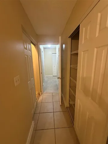 a bathroom with a glass door shower