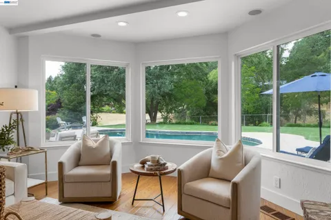 a dining room with furniture and window