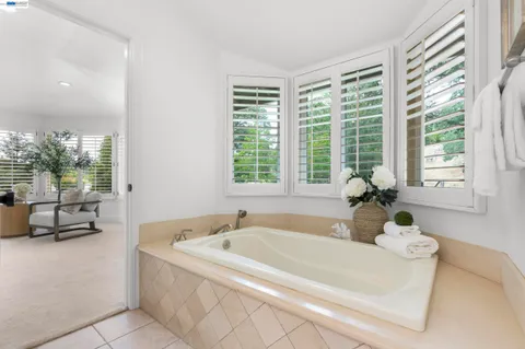 a bathroom with double sink and a mirror