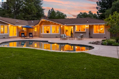 a aerial view of a house with a yard