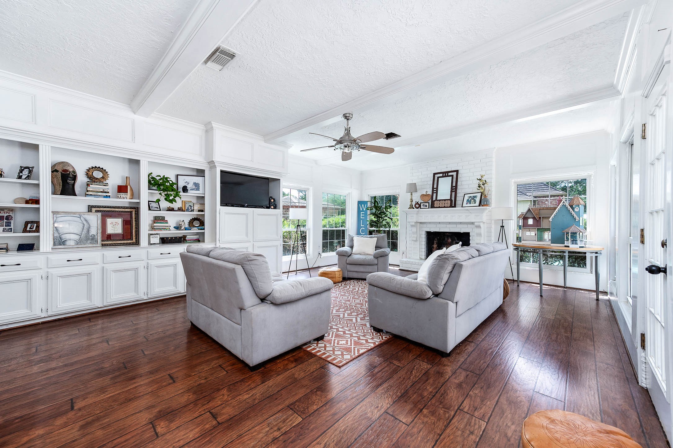 9911 Oxted Lane Spring, TX 77379 - Photo 11 of 39 a living room with furniture and a fireplace