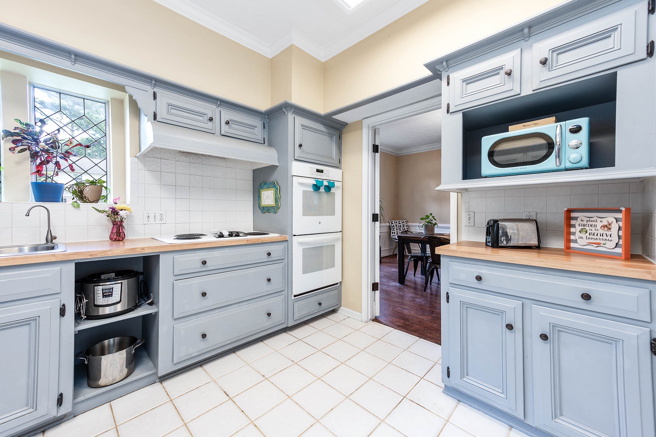 9911 Oxted Lane Spring, TX 77379 - Photo 15 of 39 a kitchen with cabinets and window