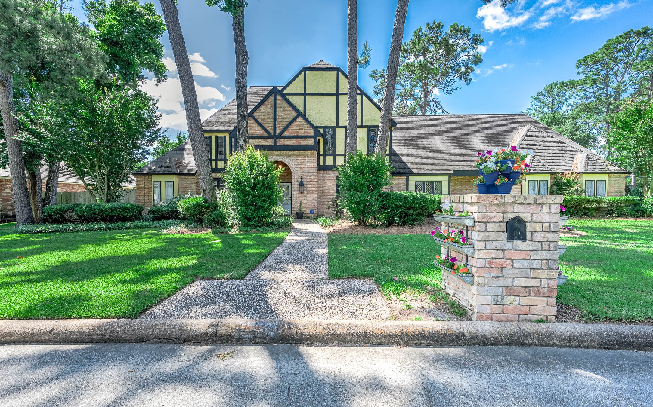 9911 Oxted Lane Spring, TX 77379 - Photo 2 of 39 a front view of house with yard and green space
