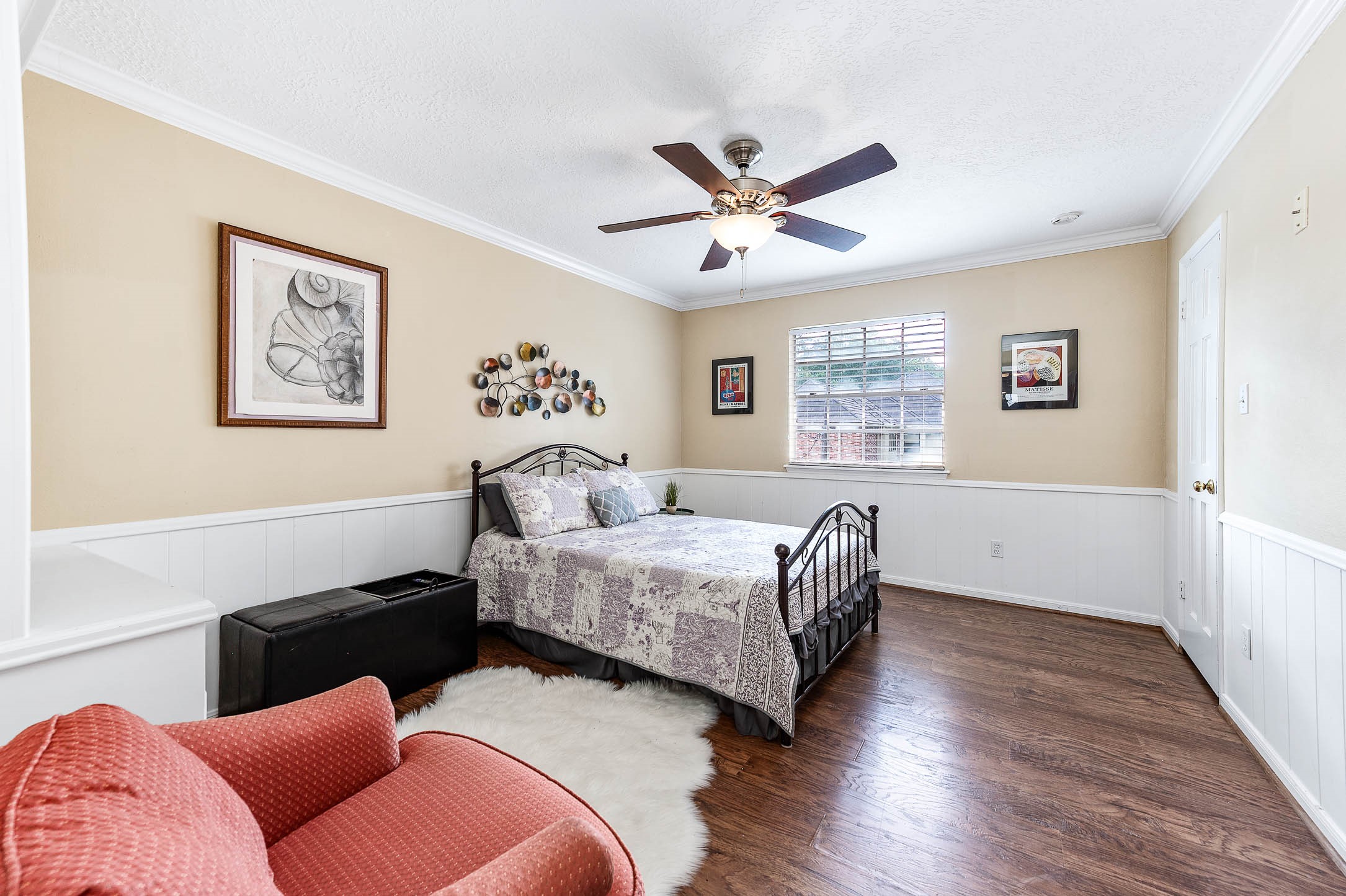 9911 Oxted Lane Spring, TX 77379 - Photo 24 of 39 a bedroom with furniture and a large window