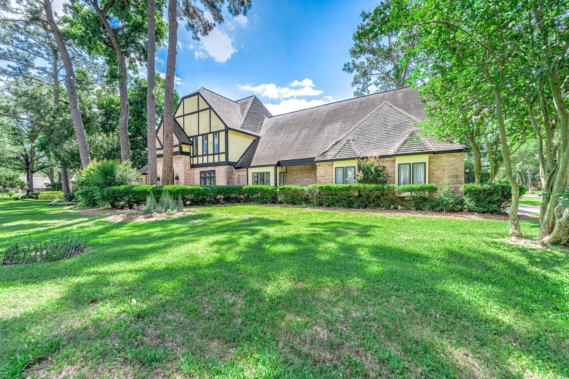 9911 Oxted Lane Spring, TX 77379 - Photo 3 of 39 a view of a front of house with a yard