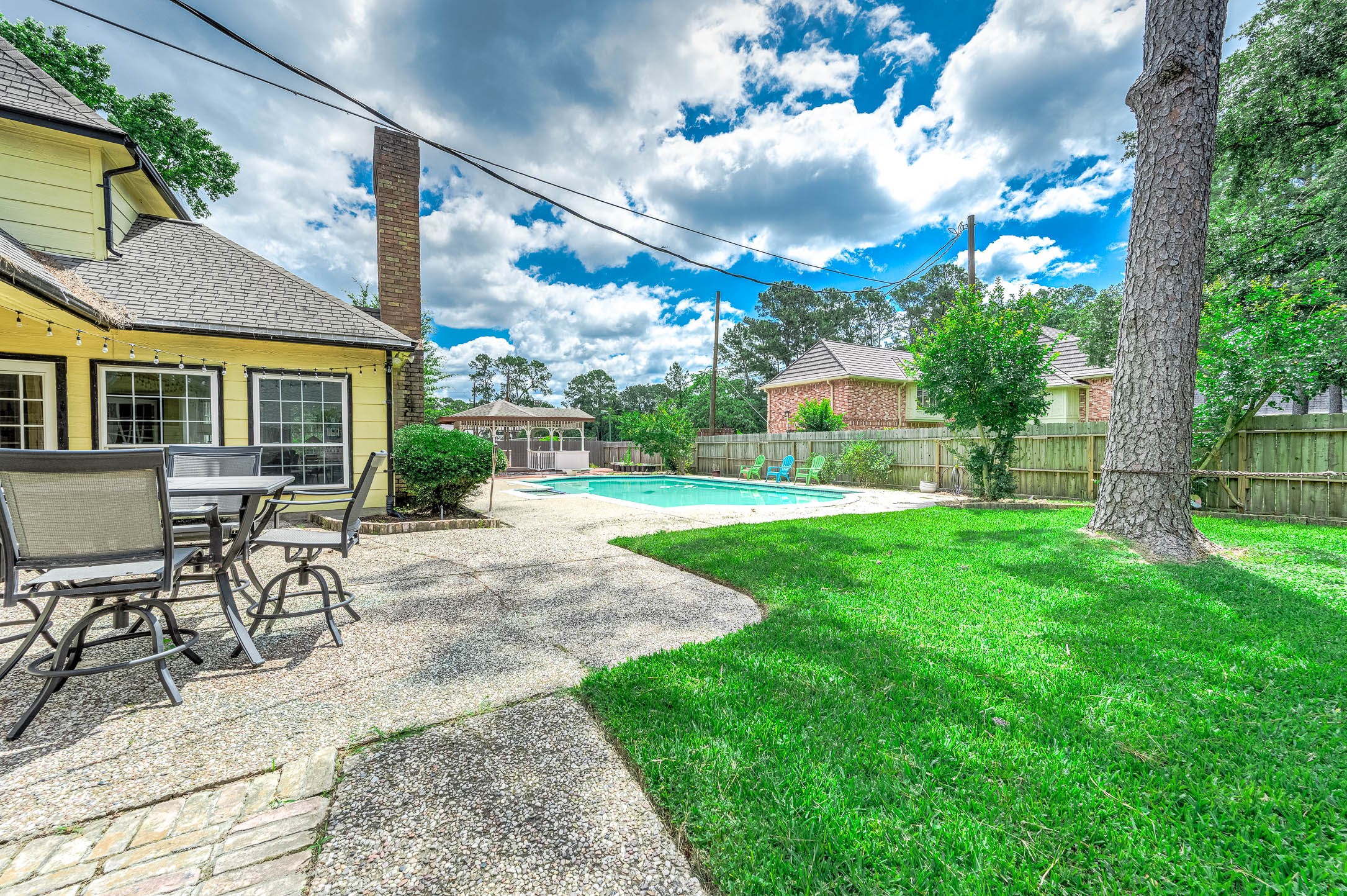 9911 Oxted Lane Spring, TX 77379 - Photo 31 of 39 a view of a house with backyard and sitting area