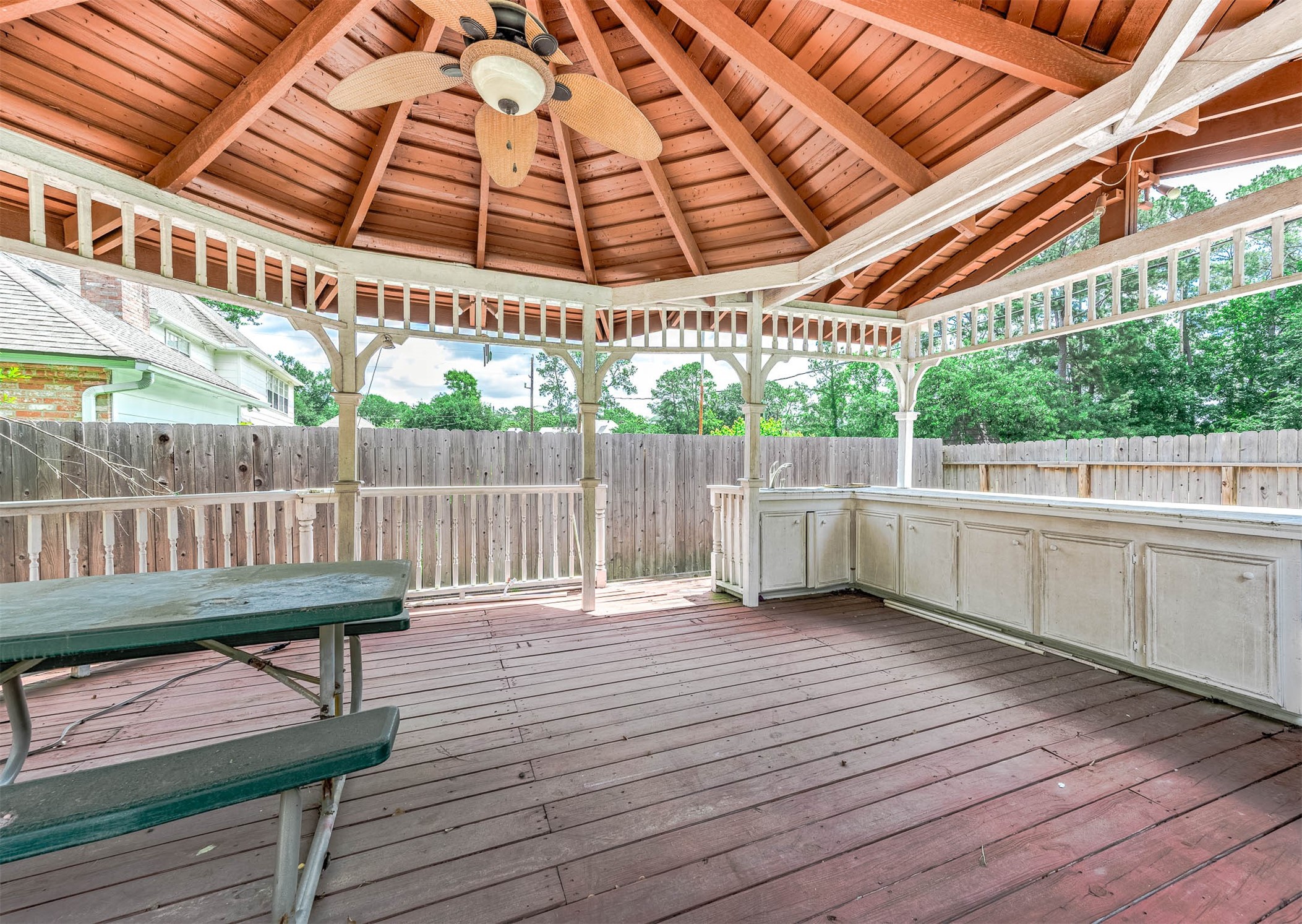 9911 Oxted Lane Spring, TX 77379 - Photo 35 of 39 a view of a roof deck with furniture and wooden floor