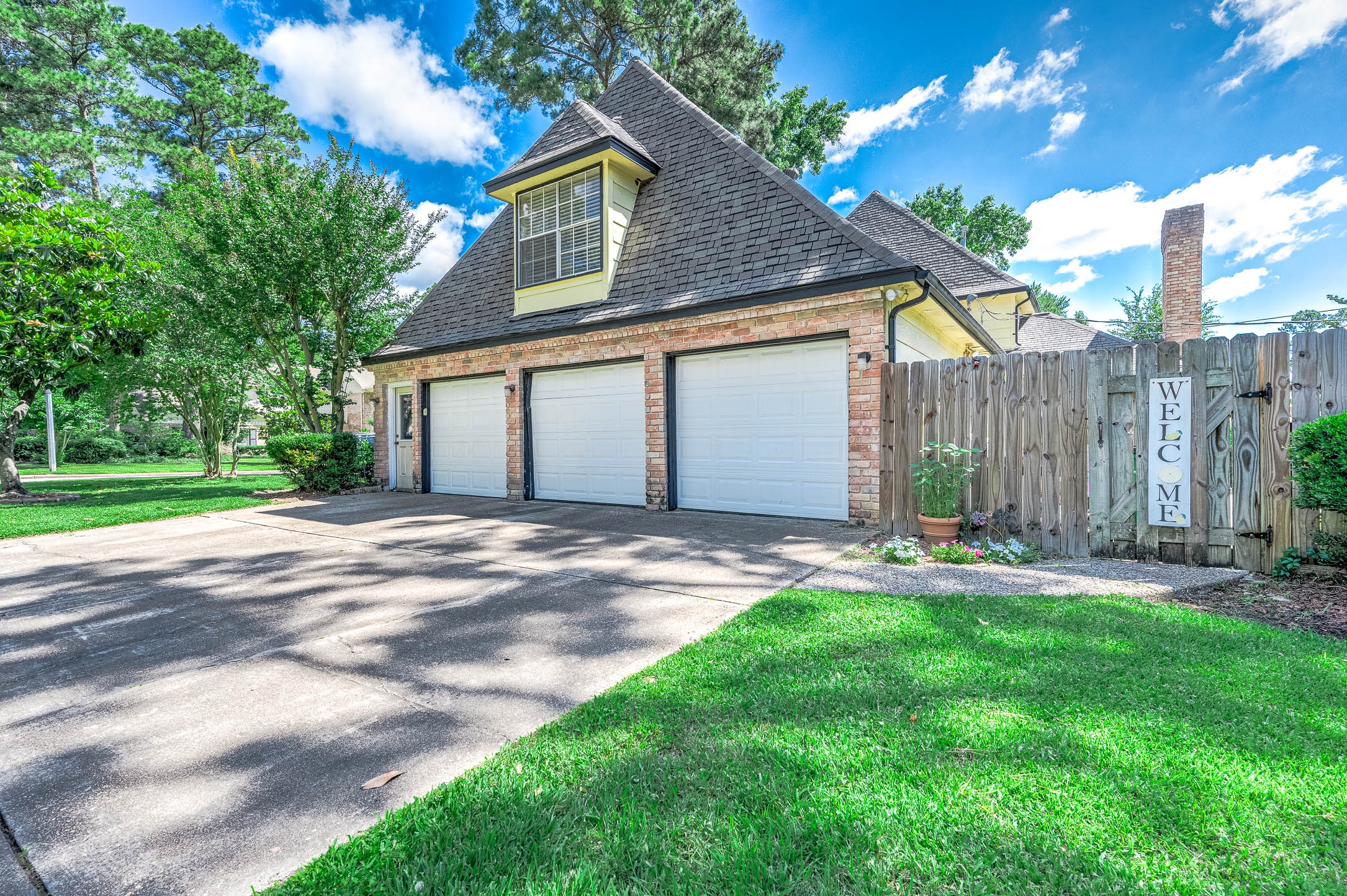 9911 Oxted Lane Spring, TX 77379 - Photo 36 of 39 a front view of a house with a yard and garage