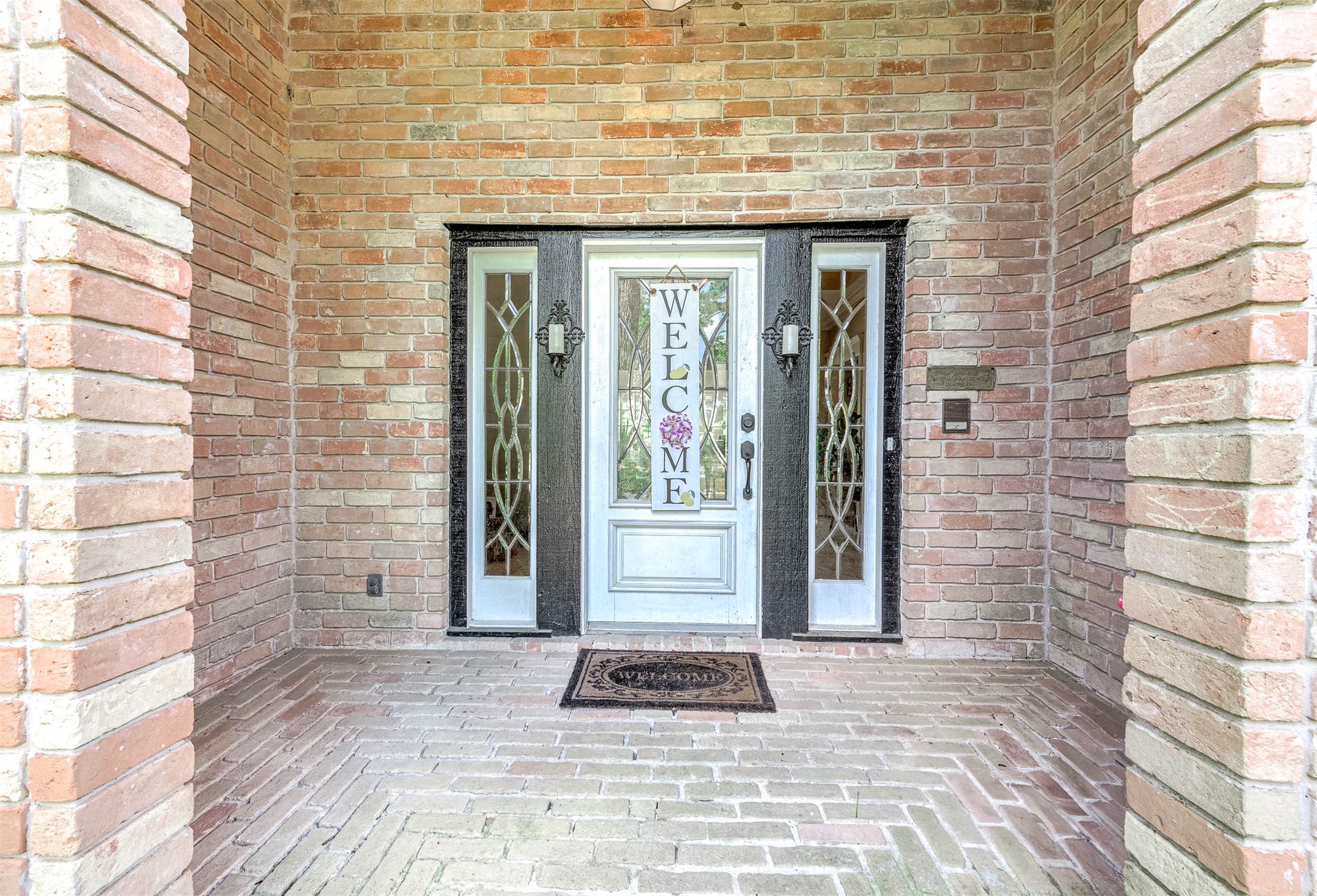 9911 Oxted Lane Spring, TX 77379 - Photo 4 of 39 a brick house with a large window