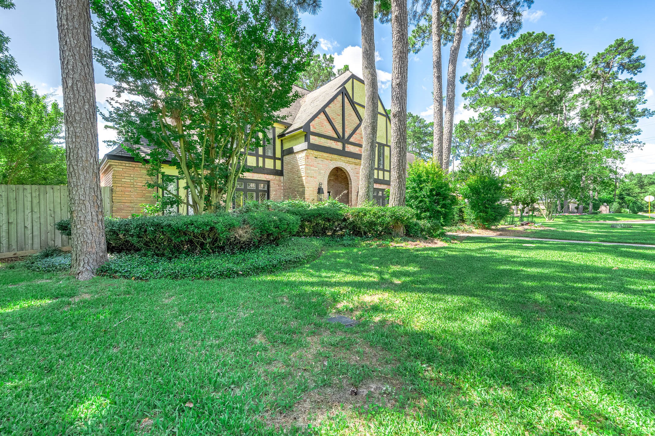 9911 Oxted Lane Spring, TX 77379 - Photo 5 of 39 a front view of a house with a yard