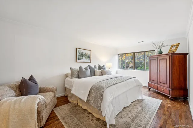 a bed room with a bed and a window