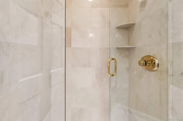 a bathroom with a bath tub and shower