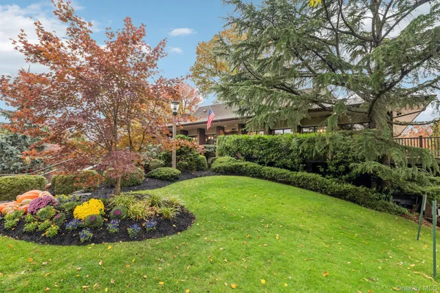 a view of a garden with a house