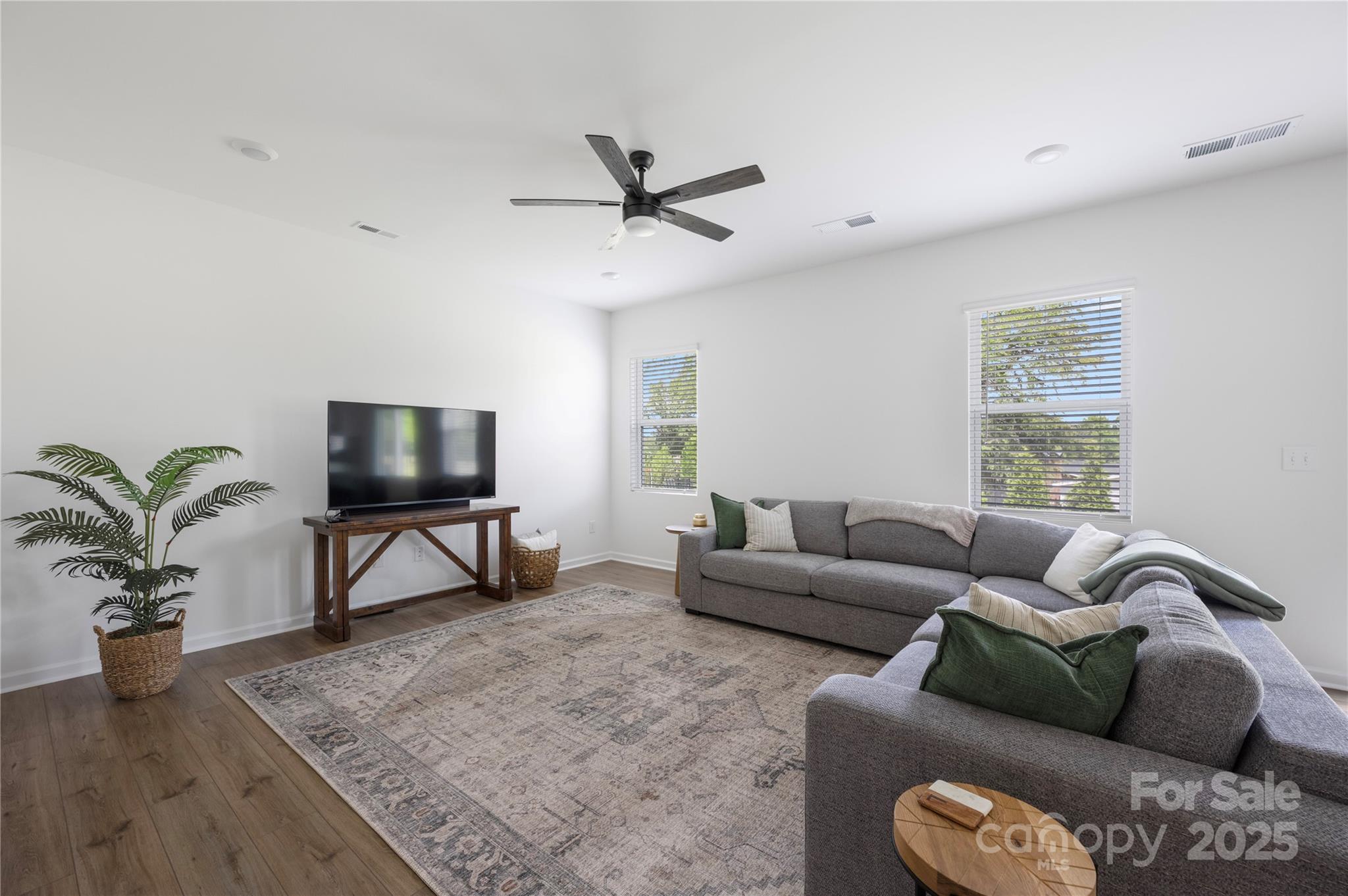 699 Kitfox Drive Northwest Concord, NC 28027 - Photo 11 of 33 a living room with furniture and a flat screen tv