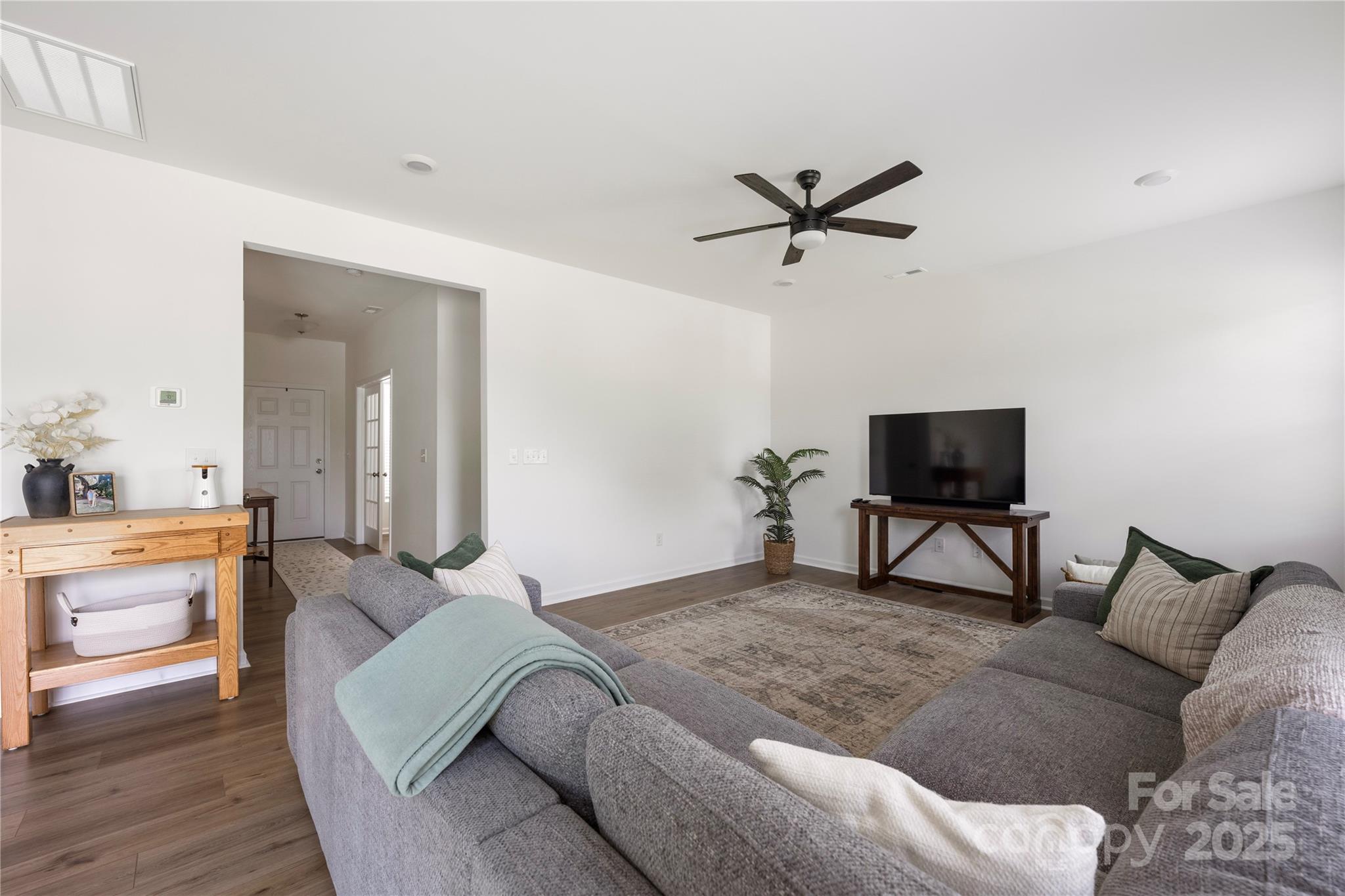 699 Kitfox Drive Northwest Concord, NC 28027 - Photo 14 of 33 a bedroom with a bed and a flat screen tv