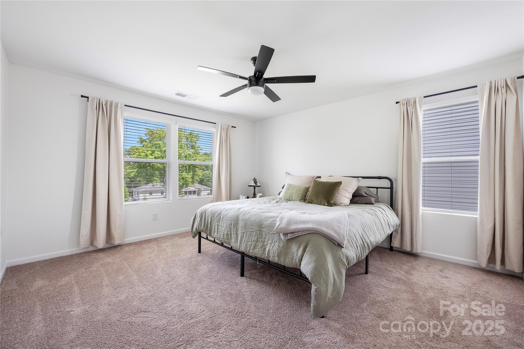 699 Kitfox Drive Northwest Concord, NC 28027 - Photo 16 of 33 a spacious bedroom with a bed and a window