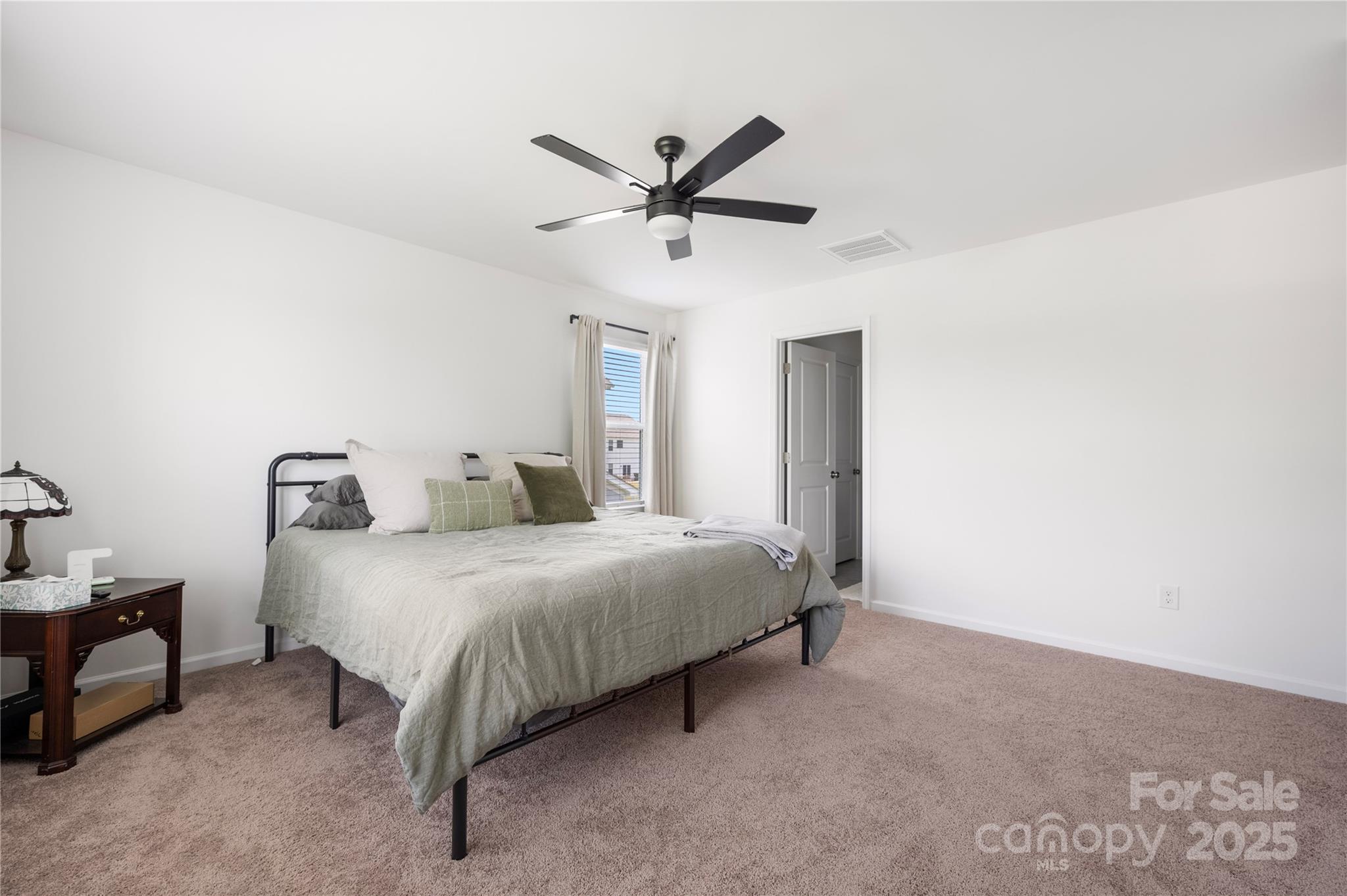 699 Kitfox Drive Northwest Concord, NC 28027 - Photo 17 of 33 a bedroom with a bed and window