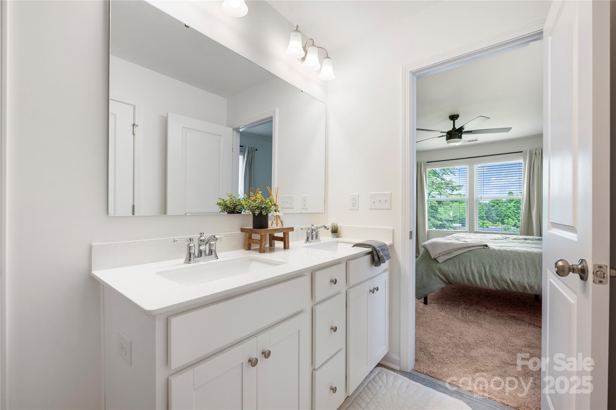 699 Kitfox Drive Northwest Concord, NC 28027 - Photo 20 of 33 a en suite bathroom with 2 sink and a mirror