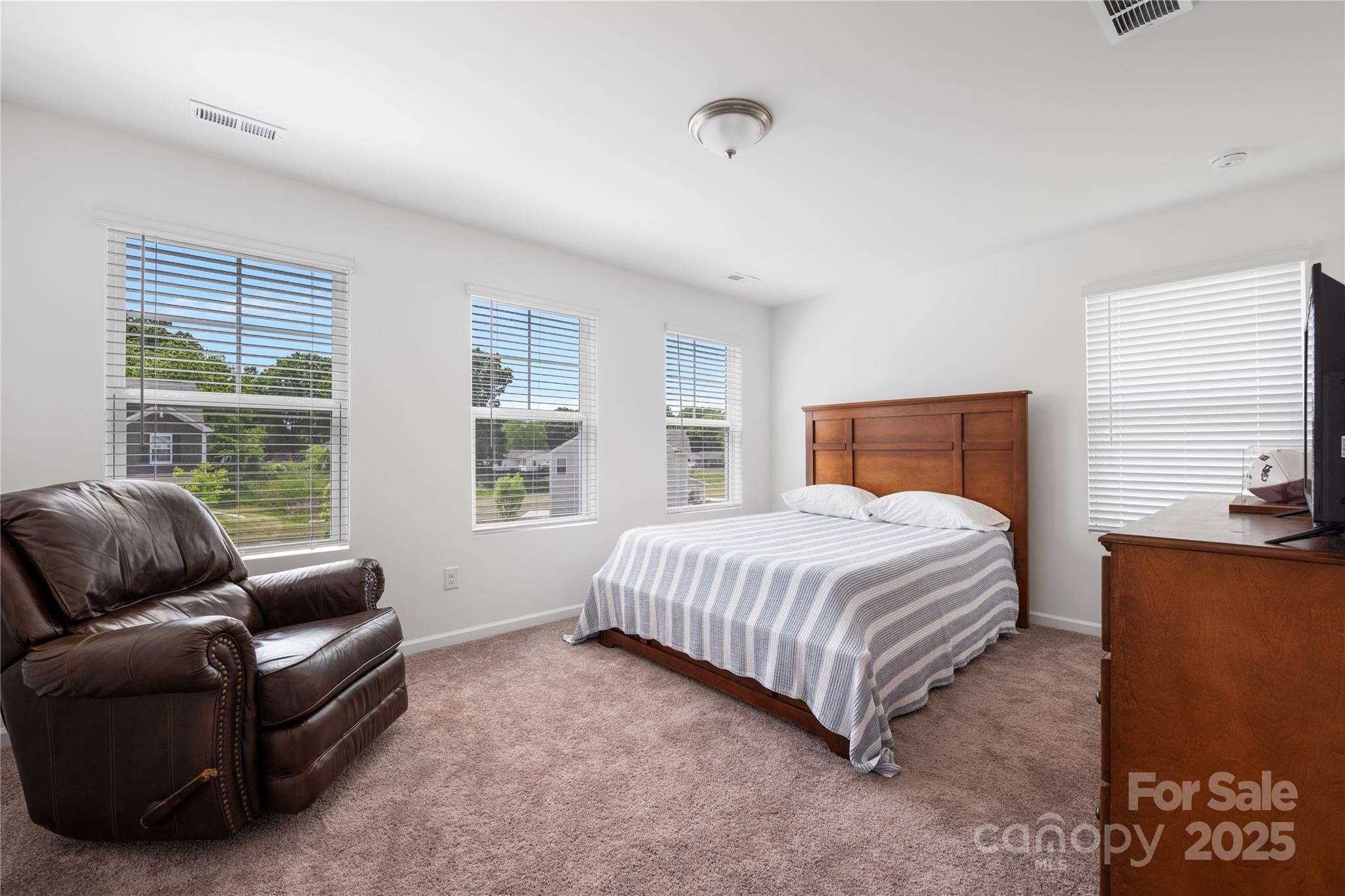 699 Kitfox Drive Northwest Concord, NC 28027 - Photo 21 of 33 a bedroom with bed couch and window