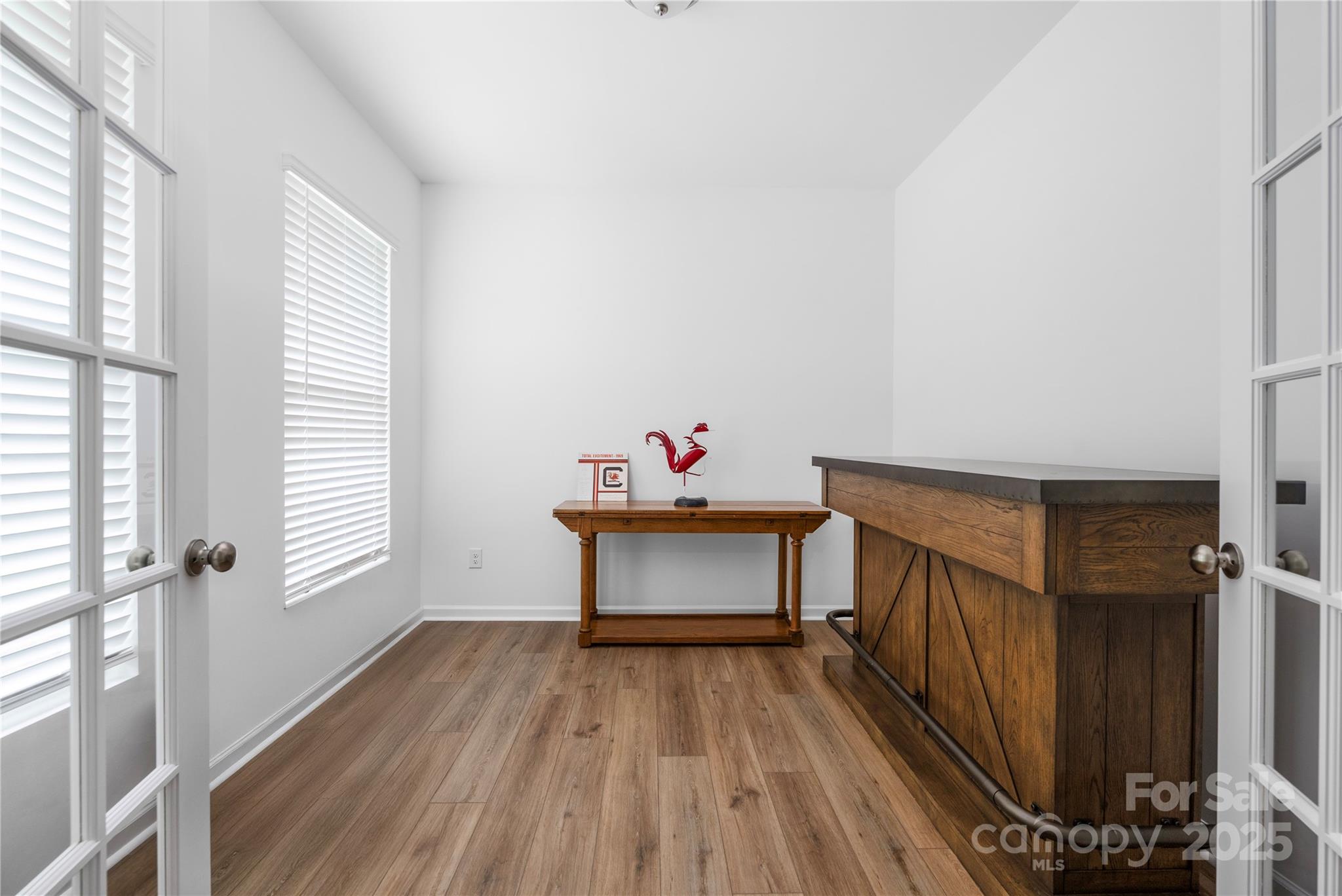 699 Kitfox Drive Northwest Concord, NC 28027 - Photo 5 of 33 a room with wooden floor and window