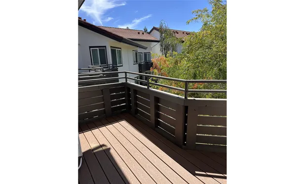 a picture of a bench in front of a house