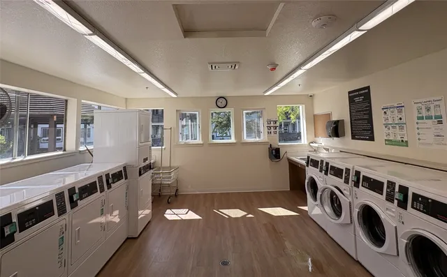 a view of an entryway with wooden floor