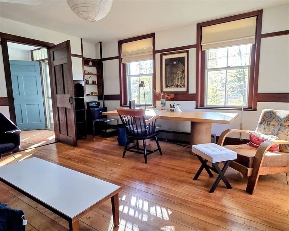 78 Shaker Road Harvard, MA 01451 - Photo 11 of 42 a living room with furniture a window and a flat screen tv