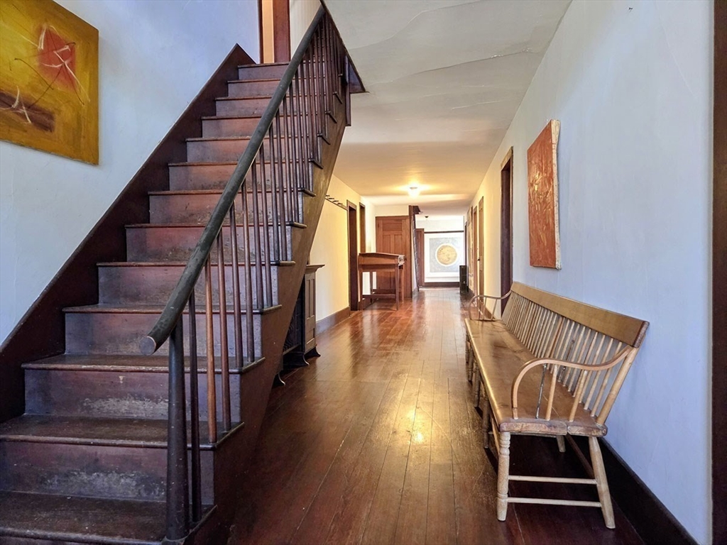 78 Shaker Road Harvard, MA 01451 - Photo 6 of 42 a view of entryway with wooden floor and stairs