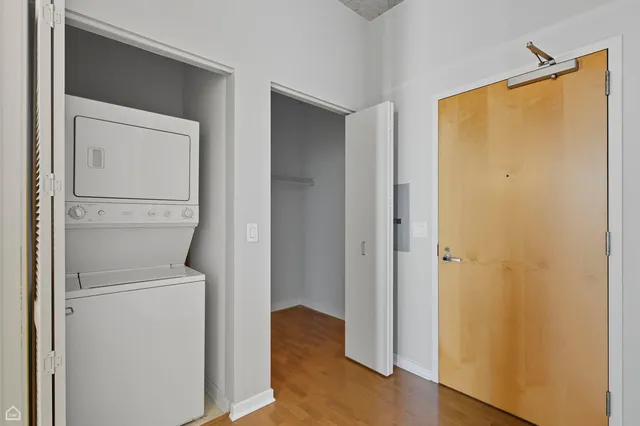 a view of a storage & utility room with a washer dryer