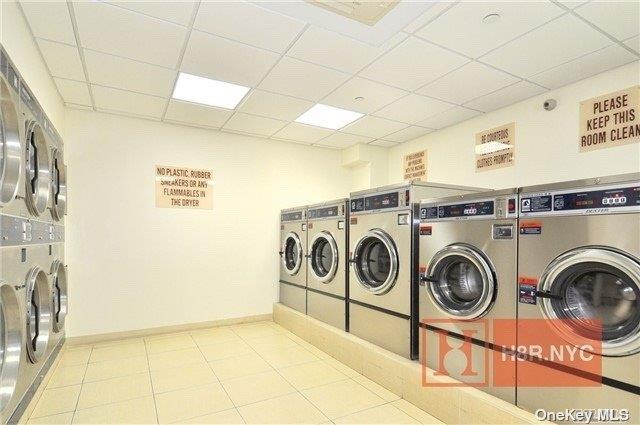 40-40 75th Street, Unit 3J Queens, NY 11373 - Photo 12 of 17 a utility room with dryer and washer