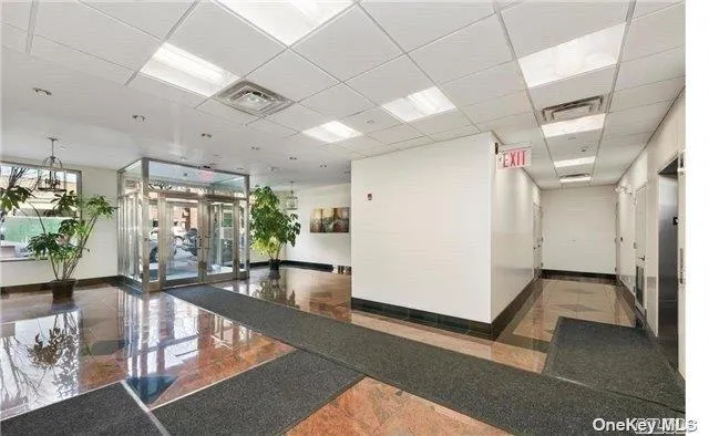 a view of a livingroom with furniture and a potted plant