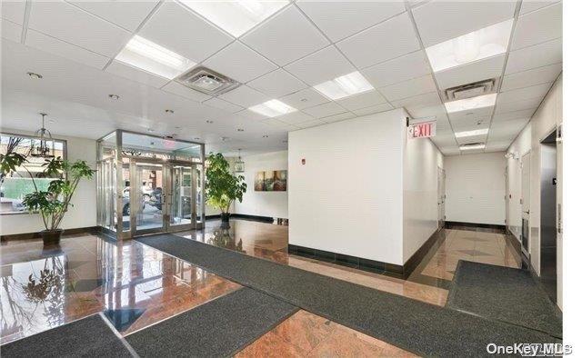 40-40 75th Street, Unit 3J Queens, NY 11373 - Photo 4 of 17 a view of a livingroom with furniture and a potted plant
