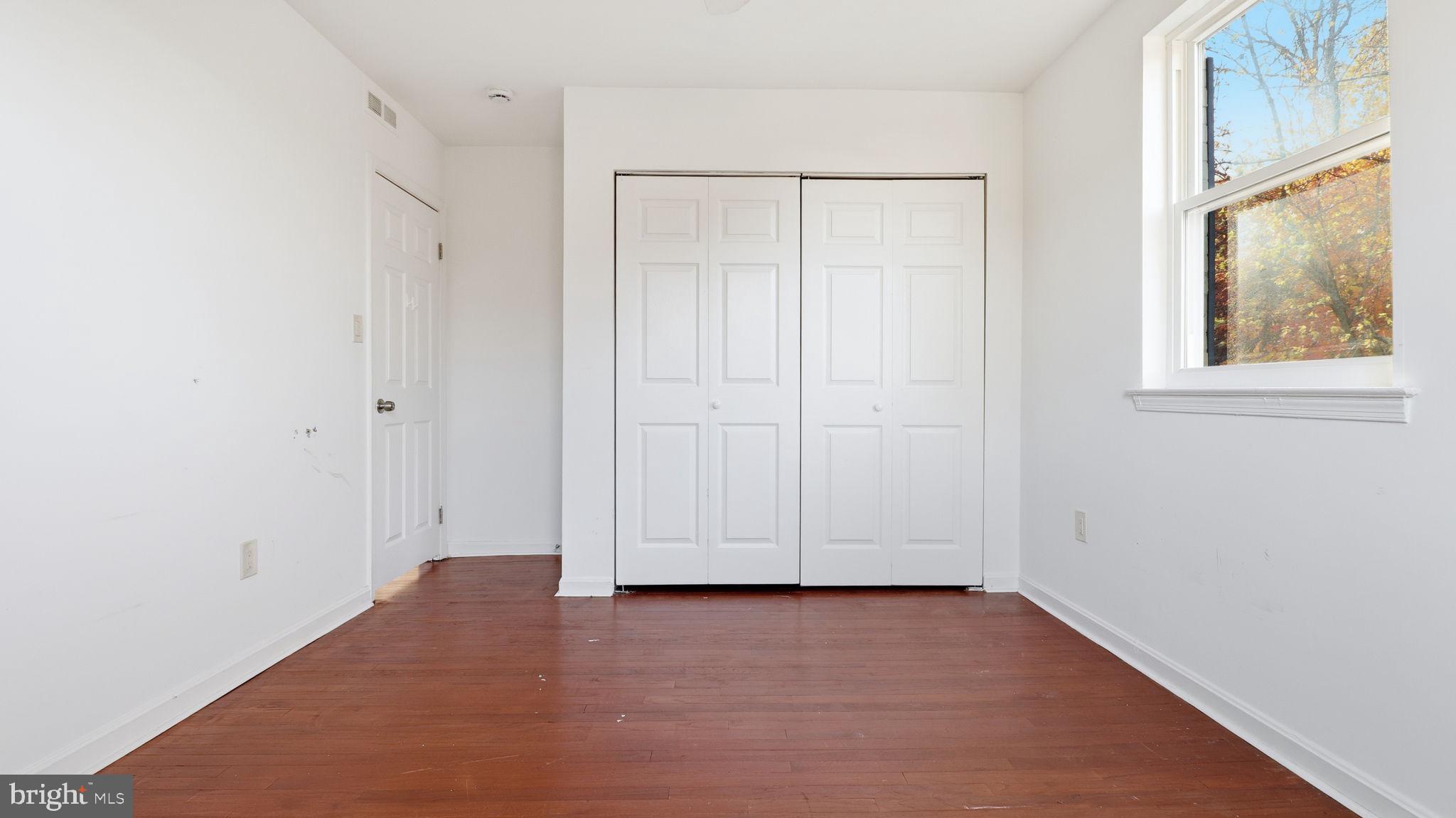 1601 Addison Road South District Heights, MD 20747 - Photo 15 of 21 a view of room with hardwood floor and window