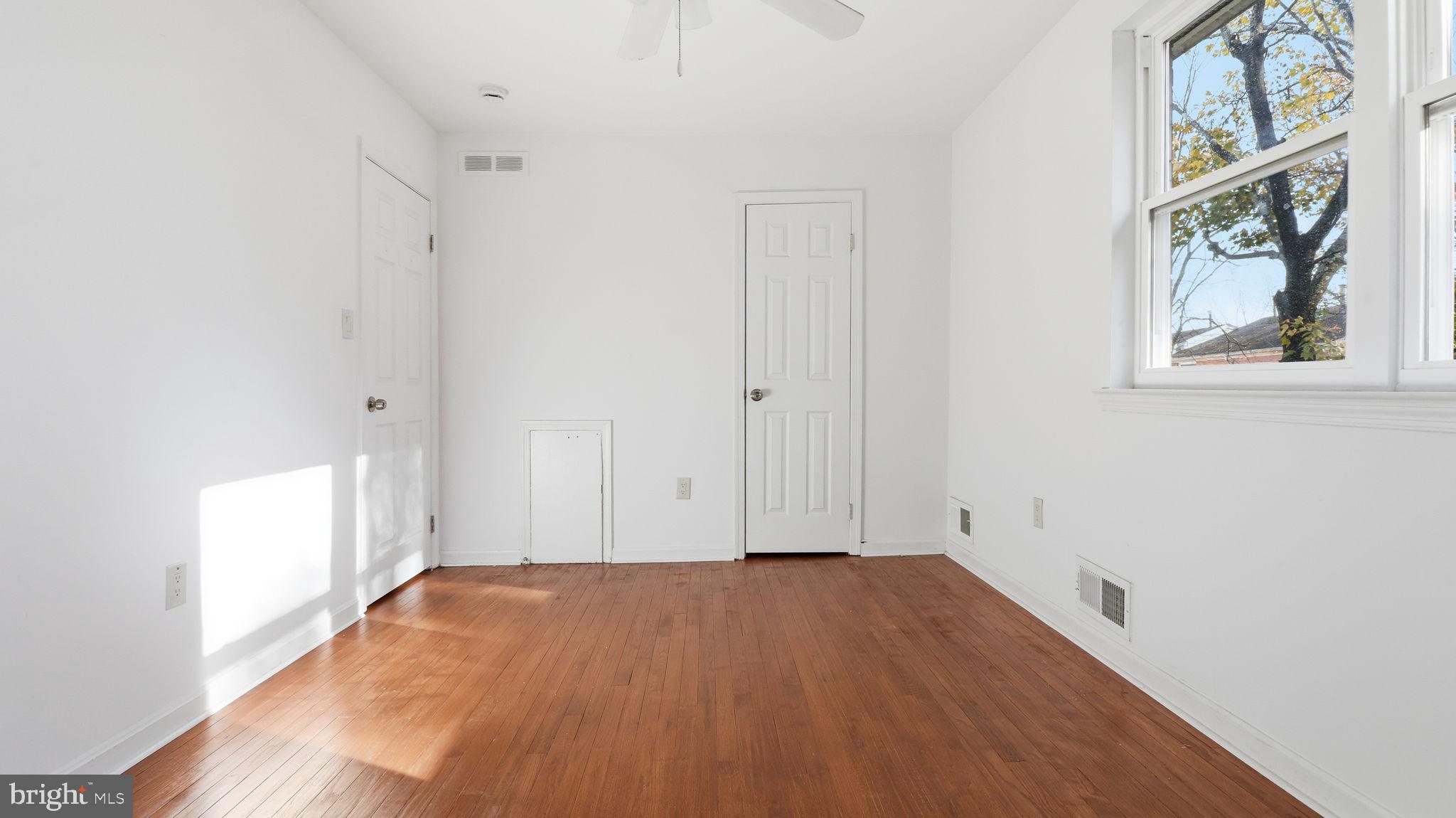 1601 Addison Road South District Heights, MD 20747 - Photo 18 of 21 a view of empty room with wooden floor