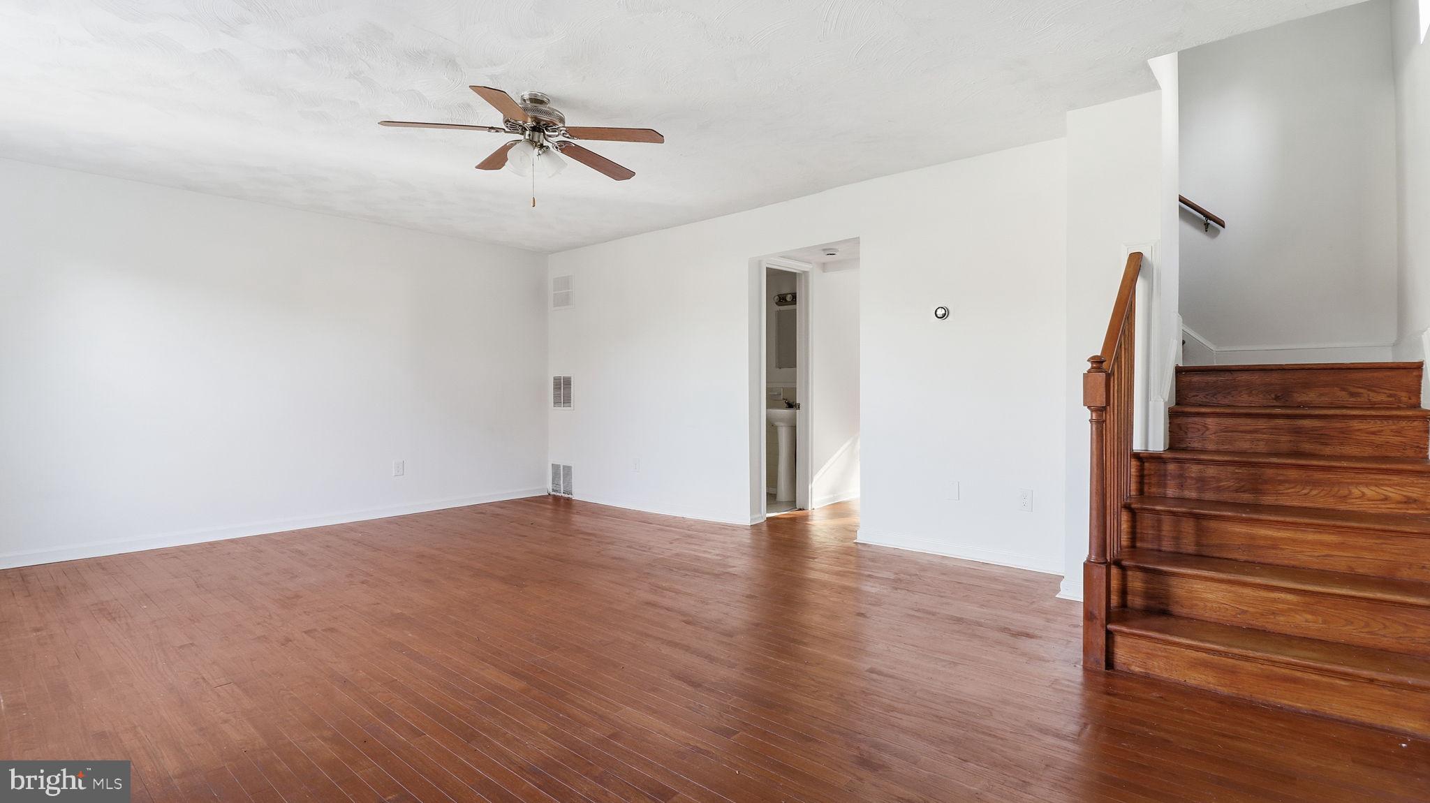 1601 Addison Road South District Heights, MD 20747 - Photo 5 of 21 wooden floor in an empty room