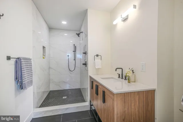 a bathroom with a sink and shower