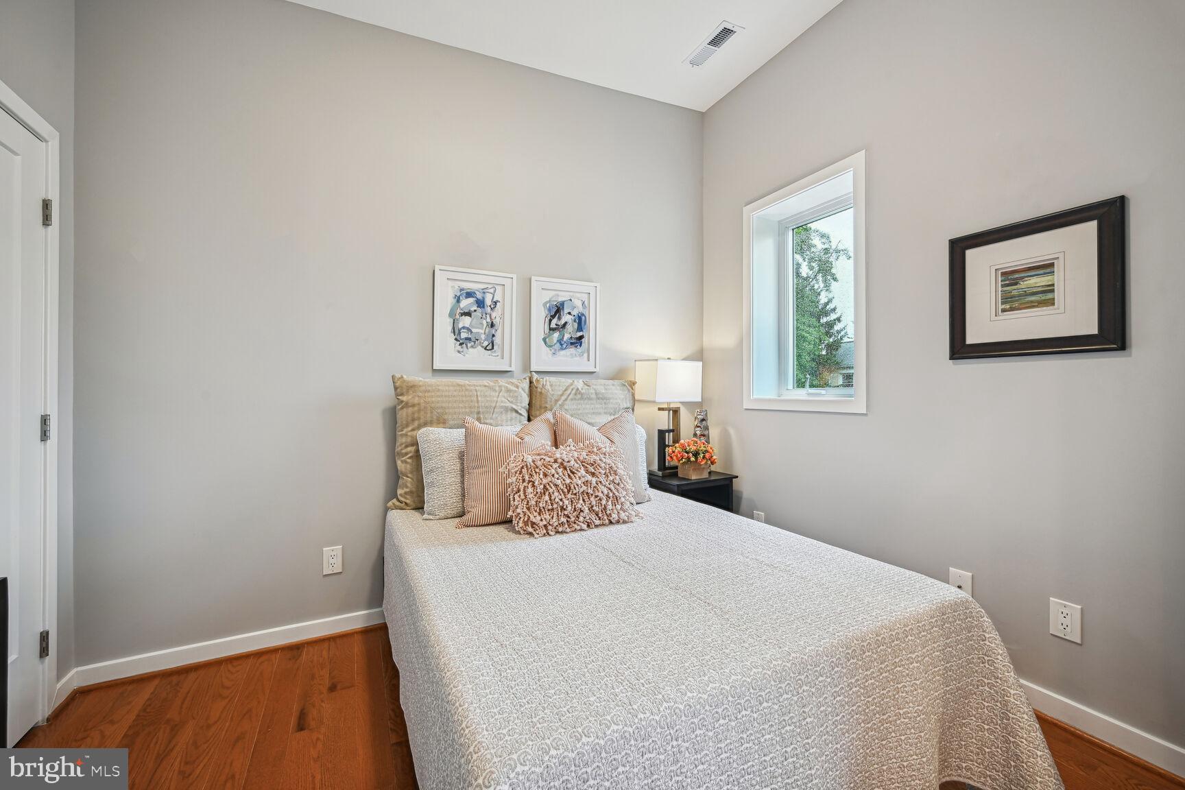 3552 Warder Street Northwest, Unit 1 Washington, DC 20010 - Photo 10 of 21 a bedroom with a bed and a window