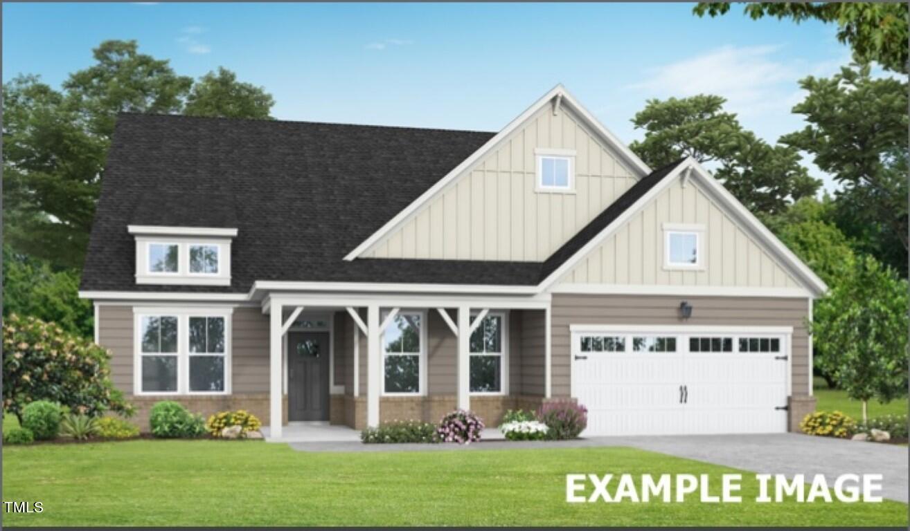 225 Highland Ridge Lane Knightdale, NC 27545 - Photo 1 of 38 a front view of a house with garden