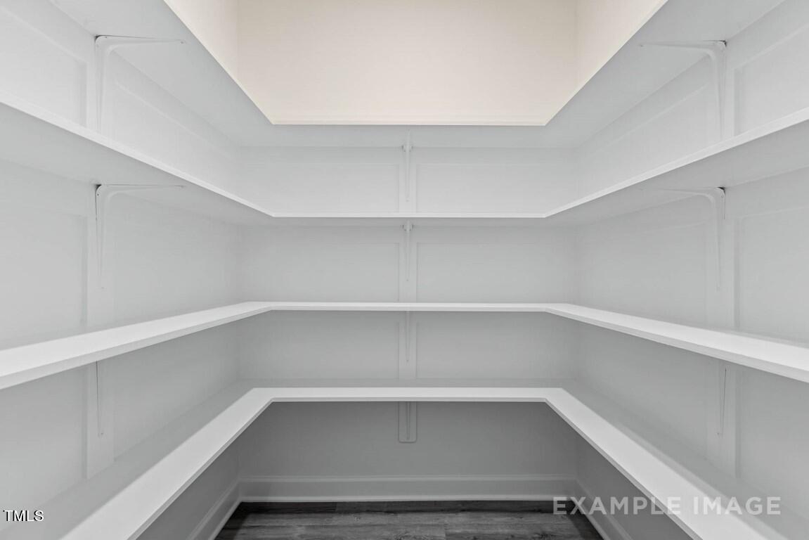225 Highland Ridge Lane Knightdale, NC 27545 - Photo 19 of 38 a storage room with empty racks