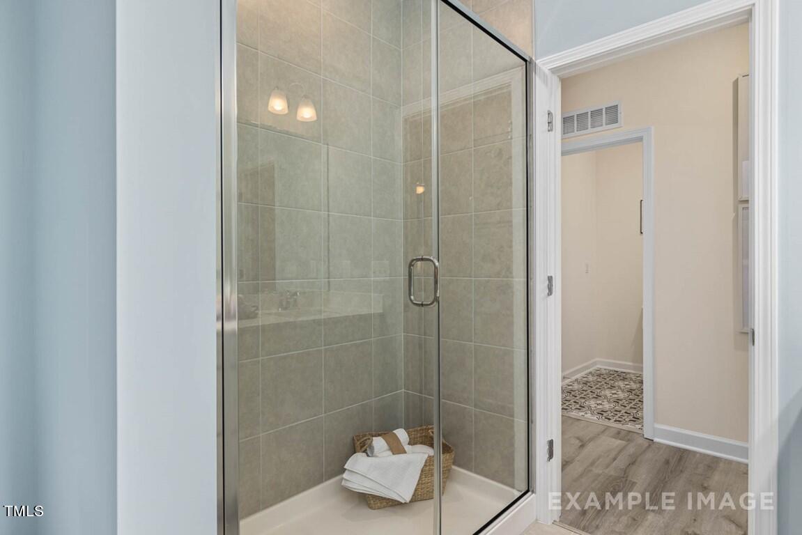 225 Highland Ridge Lane Knightdale, NC 27545 - Photo 32 of 38 a bathroom with a shower